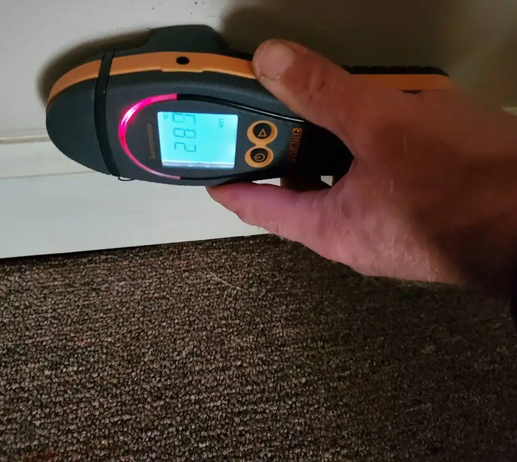 Moisture detection at baseboard during Storm Damage Restoration in Franklin Lakes
